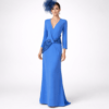 Vestido largo de fiesta azul con escote en V, manga larga y detalle joya en la cintura